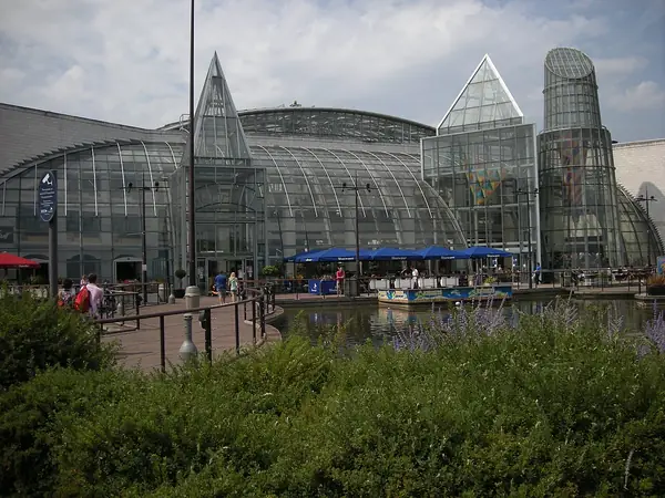 Glass entrance towers of Bluewater shopping centre beside its lake