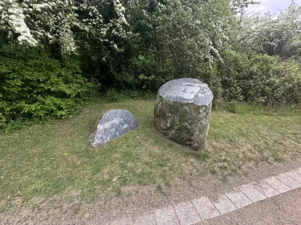 Carved stone markers beside the gravel path in Swanscombe Heritage Park