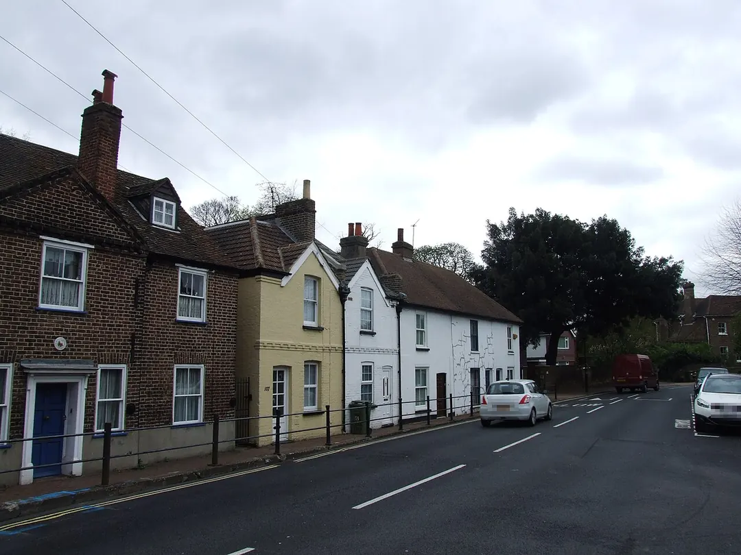 Brick and painted cottages with chimney stacks on Bexley High Street, Old Bexley