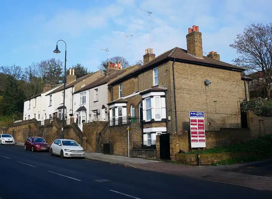 Mid-19th-century terraced cottages with chimney stacks at 84-100 Crayford High Street