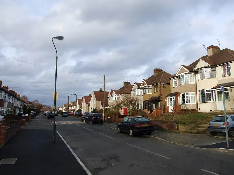 1930s semi-detached houses with gabled tiled roofs on Woodside Road, Crayford