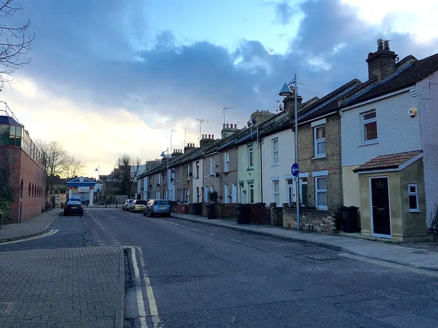 Street of painted terraced houses with slate roofs on Suffolk Road, Dartford