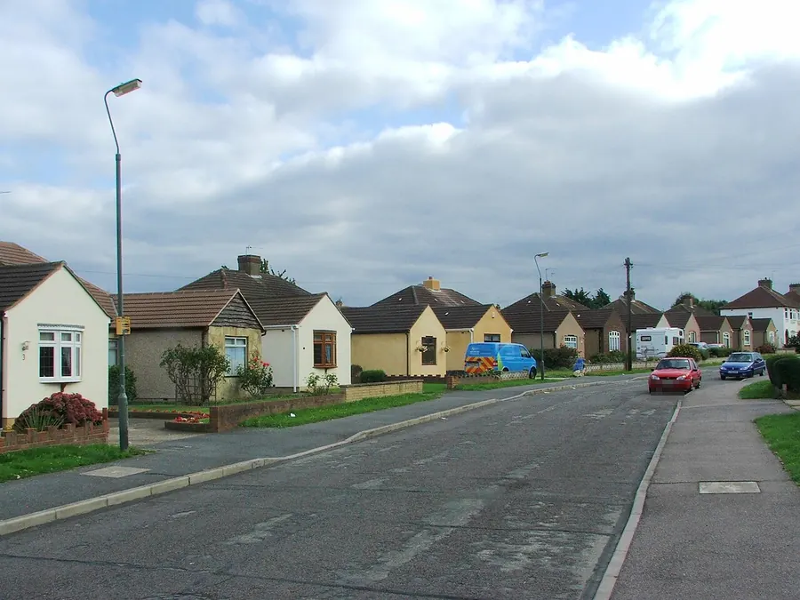 Bungalows and chalet houses with tiled roofs along Luddesdon Road, Erith