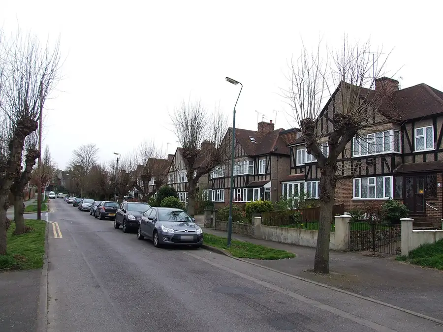 Mock-Tudor semi-detached houses with steep tiled roofs on Park Crescent Road, Erith
