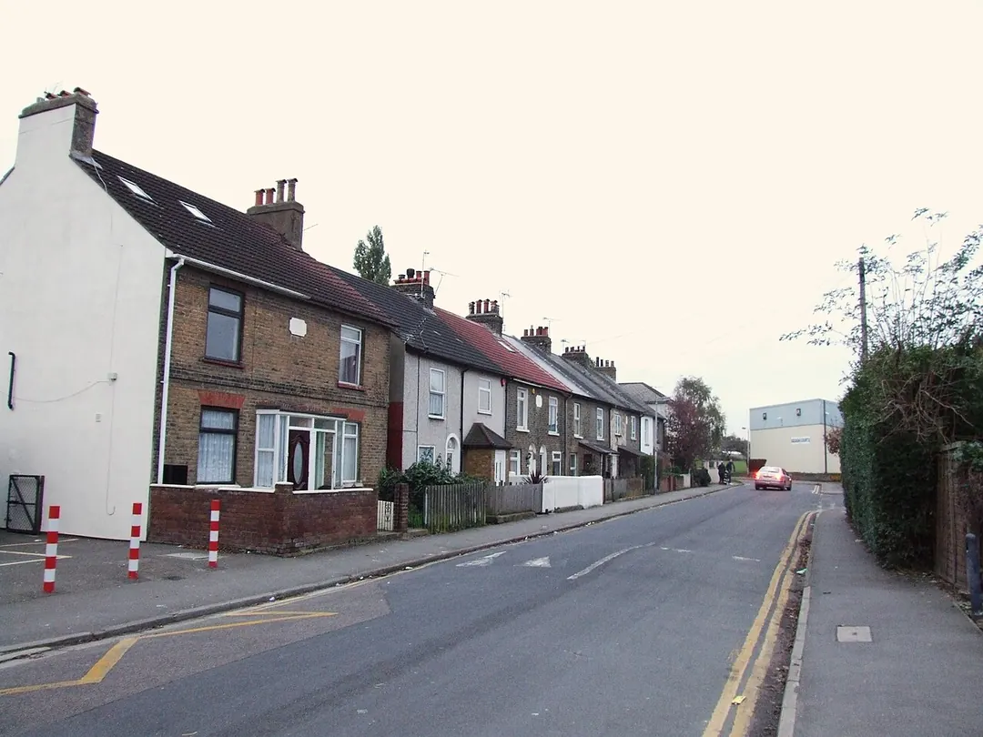 Victorian terraced houses with slate roofs and chimneys on The Grove, Swanscombe